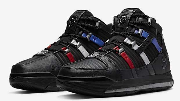 Side view of LeBron James' black and red Nike shoes.